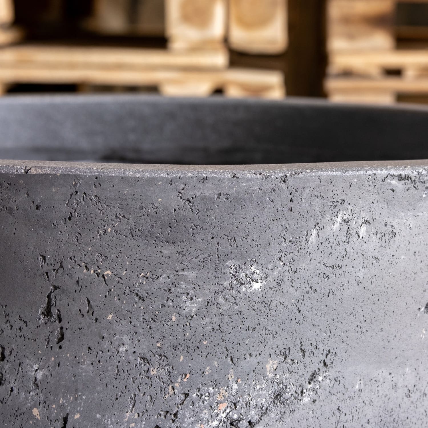 Dark gray textured concrete cylinder planter in onyx dusk colourway perfect for kitchen counters with visible aggregate