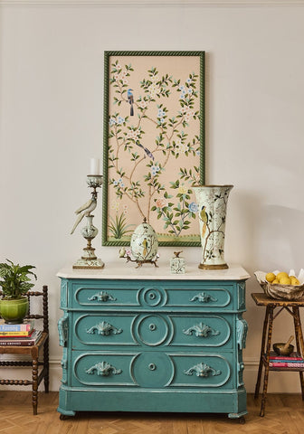 Teal painted antique style dresser with ornate carved handles and circular panels featured in aurora artisan porcelain egg box