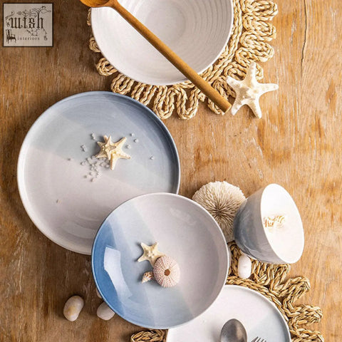 Blue and white gradient ceramic dining set plates with starfish and sea urchin accents from aurora dinner set