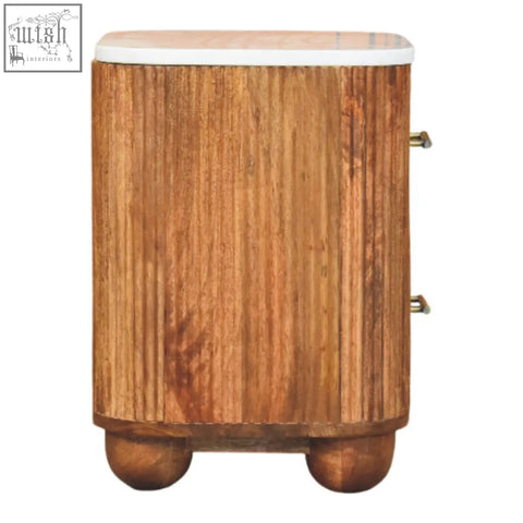 A rustic aurora marble bedside table with white marble top brass handles and solid mango wood vertical grain