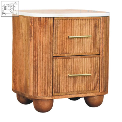 A rustic aurora marble bedside table with marble-effect solid mango wood, white marble top, and brass handles