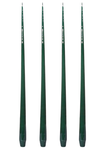 Four dark green aurora tall slender taper candles with glossy finish and decorative indentations along their length