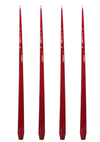 Four slender taper candles in glossy red with subtle white decorative markings from aurora tall slender taper candles