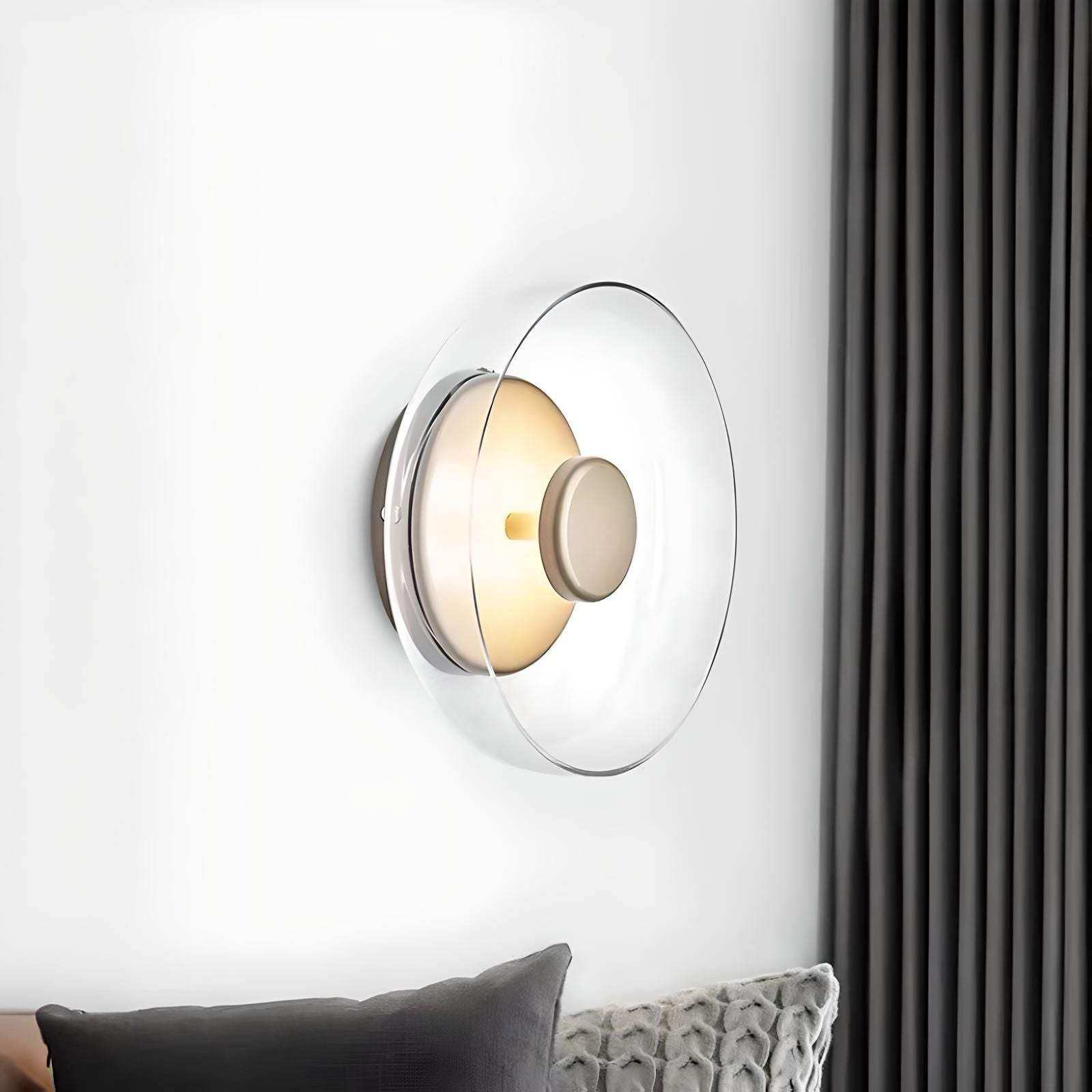 Modern minimalist aurora wall lamp with clear glass dome metallic base and warm circular light source wall lamp