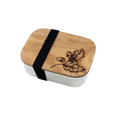 Autumn acorns lunch box is a wooden-lid lunch box with black strap and engraved leaf design perfect for autumn meals