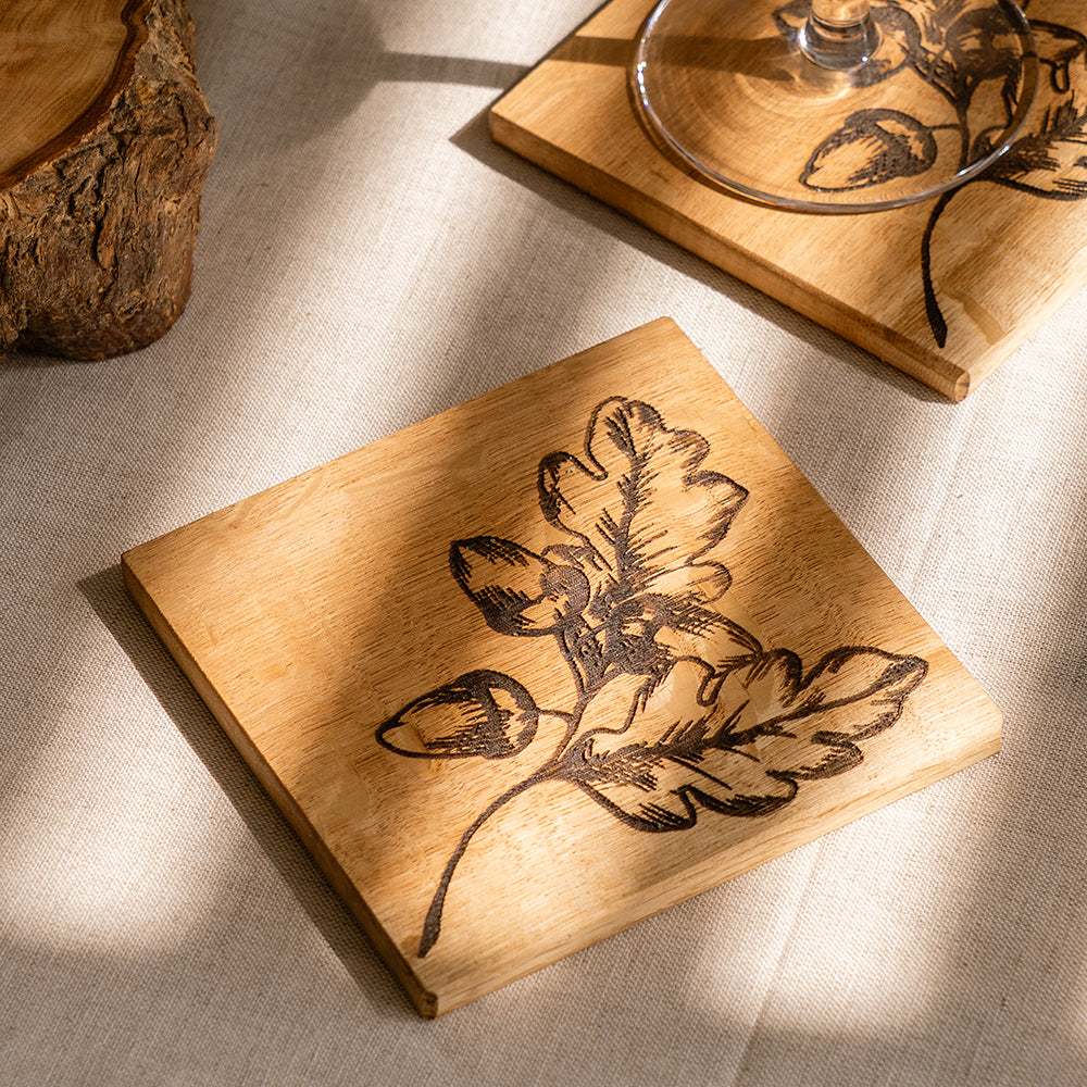 Square wooden oak coaster with dark brown autumn acorns engraved design perfect for fall decor