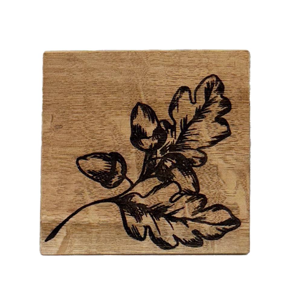 Square wooden oak coaster with dark engraved autumn acorns design perfect for fall drinks and decor