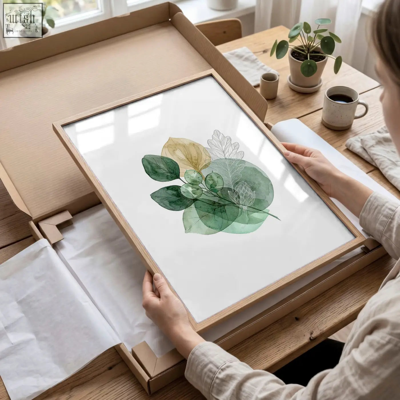 Framed autumn art botanical leaf print featuring green and gold tone leaves in light wood frame set of three prints