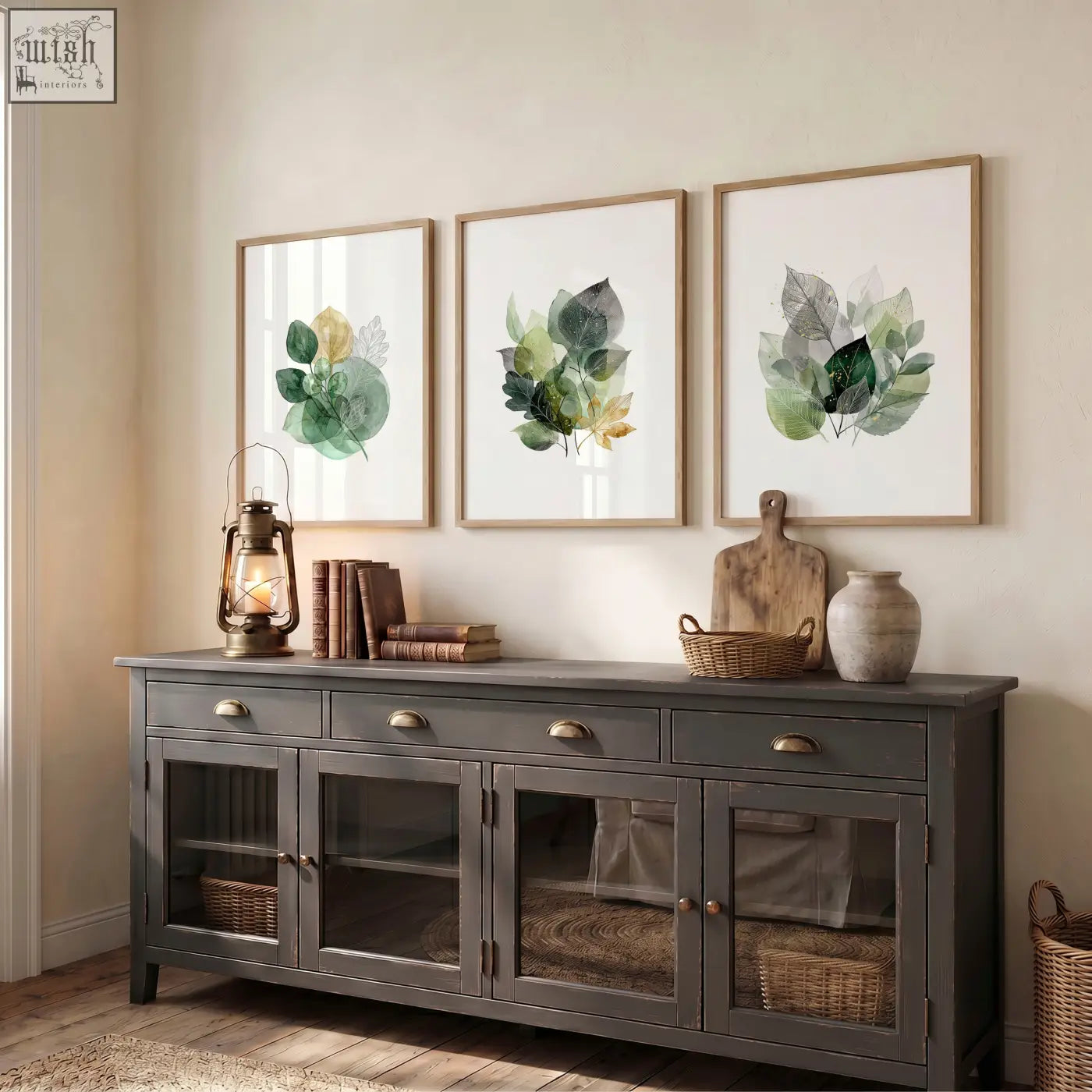 Dark gray wooden sideboard with glass paneled doors and brass handles complements autumn art botanical leaf three prints wall decor