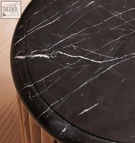 Black marble tabletop with white veining on ava luxe round bedside table for a luxe round bedside vibe
