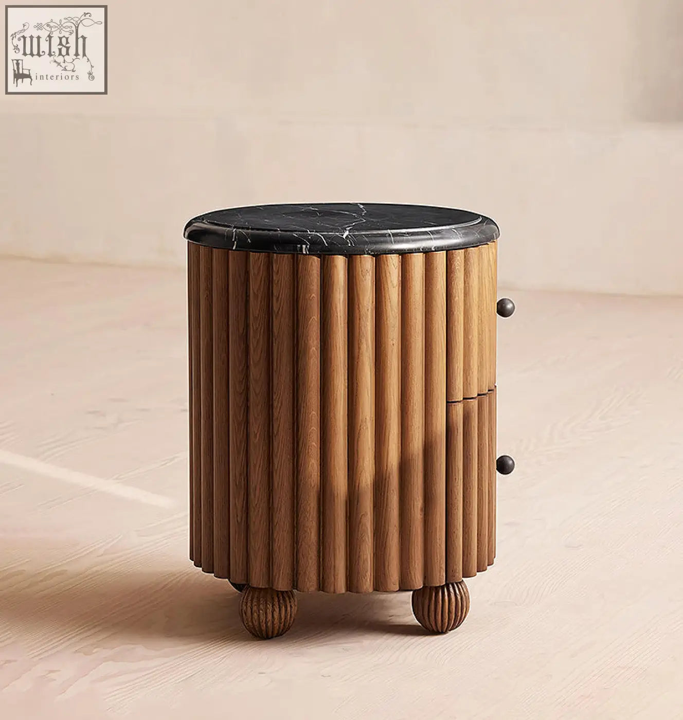 Ava luxe round bedside table with cylindrical wooden body, vertical fluted panels, black marble top, and rounded feet
