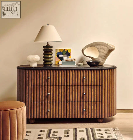 Warm-toned solid wood ava marble hallway sideboard with vertical ribbed detailing and dark metal handles
