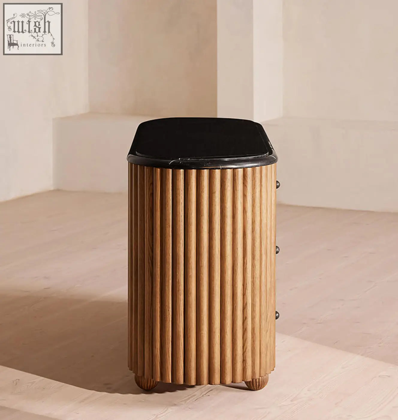 Ava marble hallway sideboard is a solid wood side table with a black marble top and sleek vertical ribs