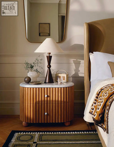 Ava rounded rectangle bedside table with a sleek curved wooden base and white marble top bedside table