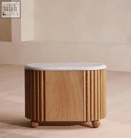 Ava rounded rectangle bedside table with polished white marble top and fluted oak wood sides on rounded feet