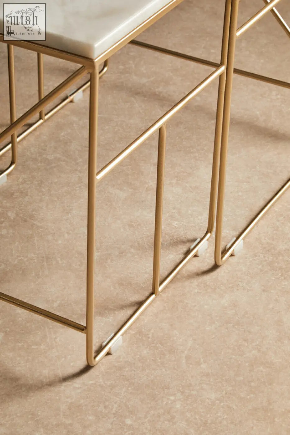 Gold metal frame square nesting tables with white marble top from the avantis marble set for stylish spaces