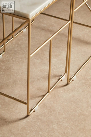 Gold metal frame square nesting tables with white marble top from the avantis marble set for stylish spaces