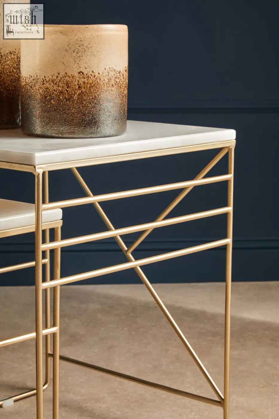 Gold-toned metal side table with white marble top and geometric frame from avantis marble set square nesting tables