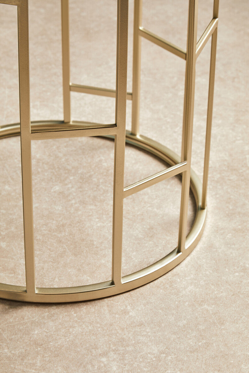 Gold-toned metal champagne finish round side table with geometric grid design and circular base from avantis set of 2