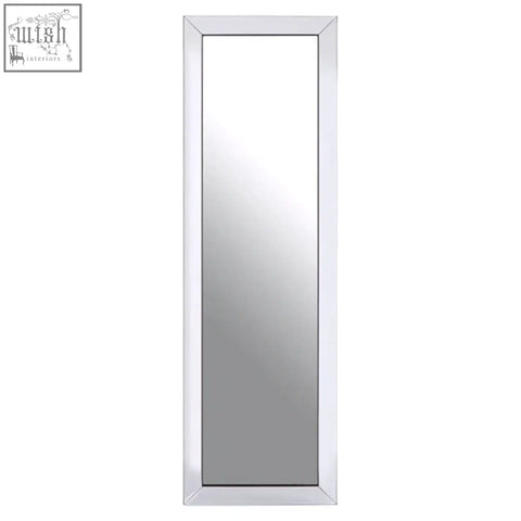 A velene tall floor standing mirror with a sleek white frame features bevelled corners for a minimalist look