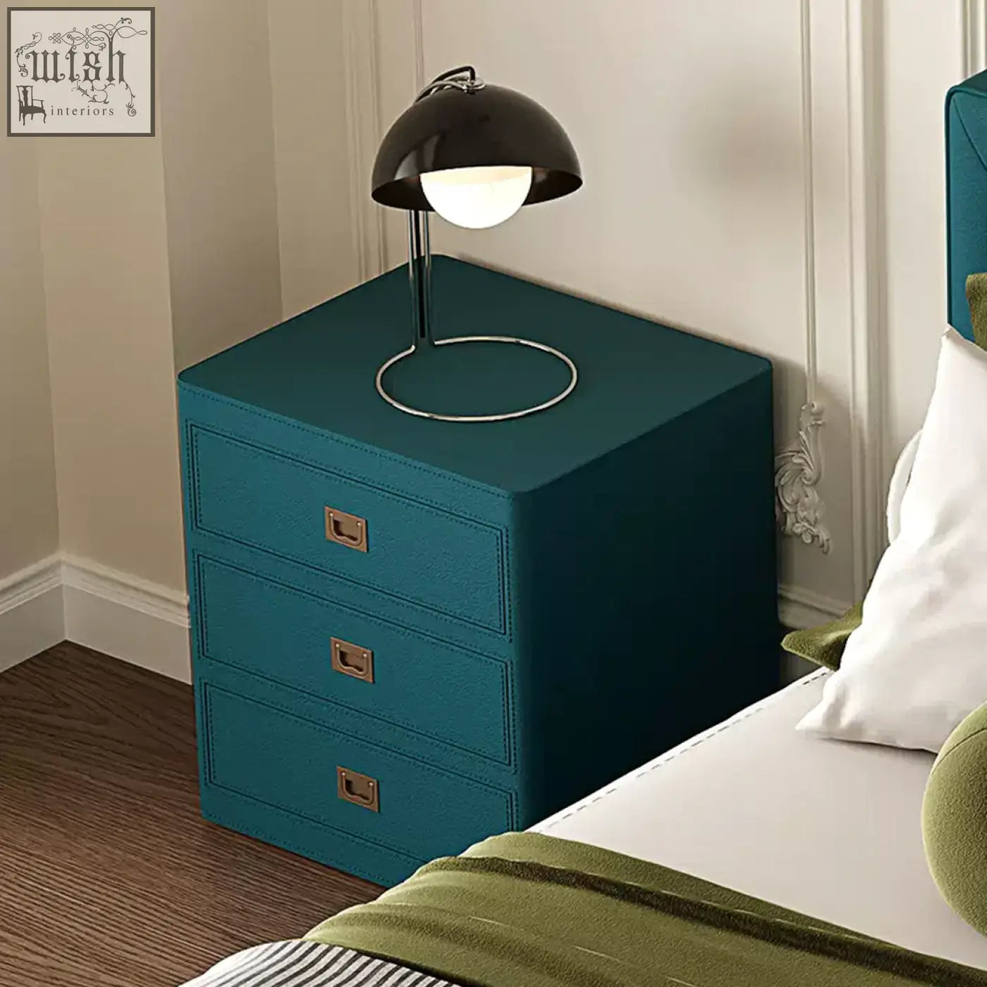 Teal leather aveline bedside table with brass drawer pulls and black dome lamp on top