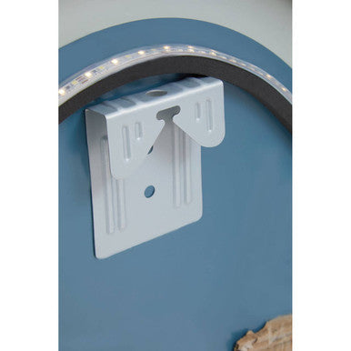 Backside of avelino illuminated led silver oval mirror showing white plastic wall mount bracket with curved hook and ridges