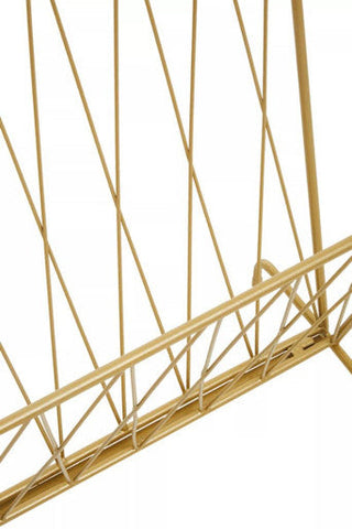 Avento gold finish magazine rack with gold wire and geometric diagonal lattice design for stylish storage