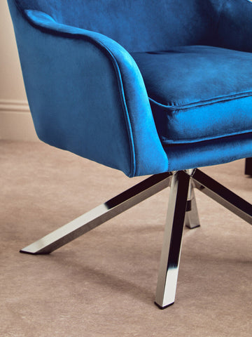 Avery midnight velvet swivel chair in vibrant blue velvet with a sleek chrome star base velvet swivel chair