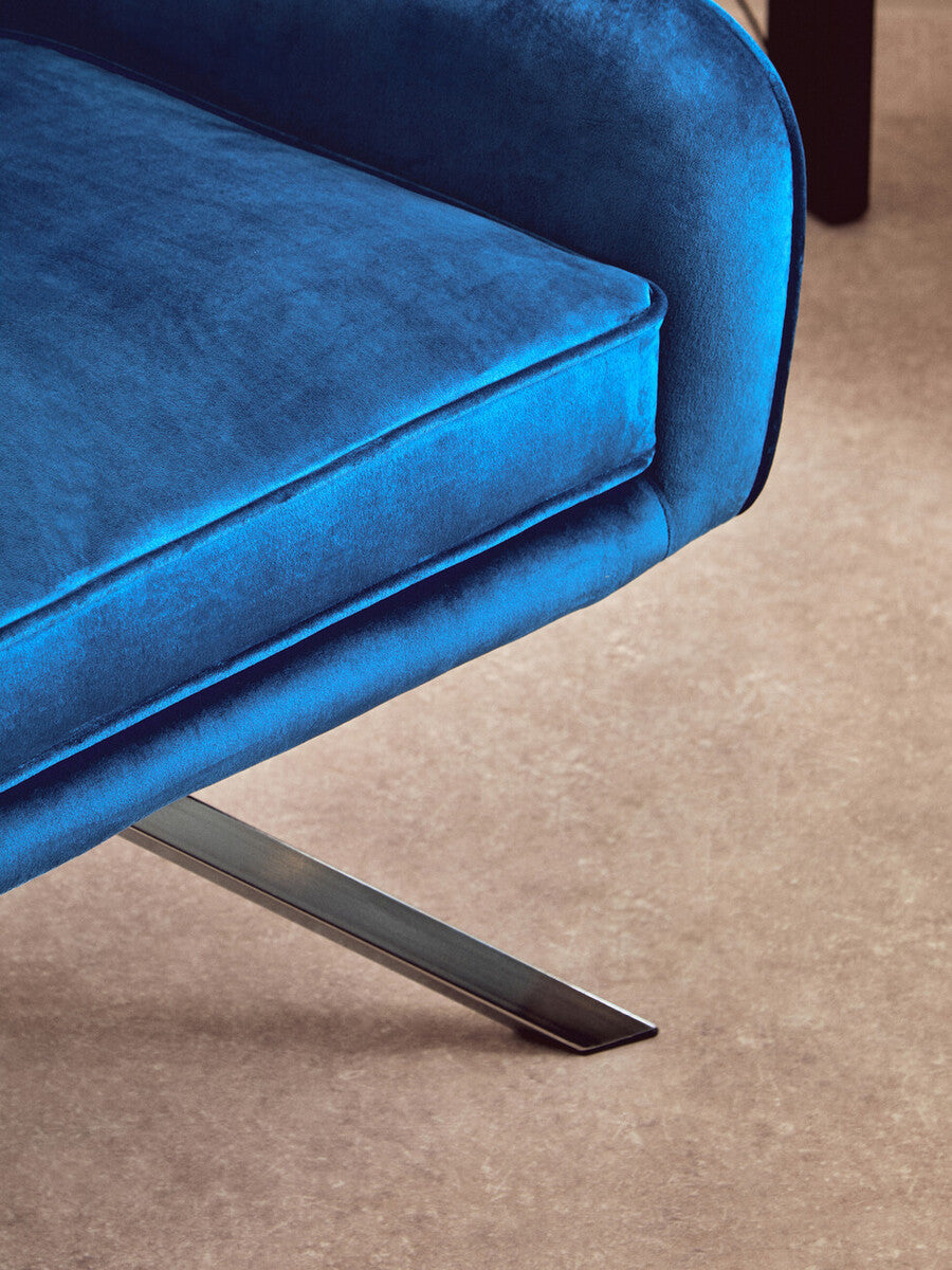 Vibrant blue avery midnight velvet swivel chair with soft velvet upholstery and sleek chrome metal legs
