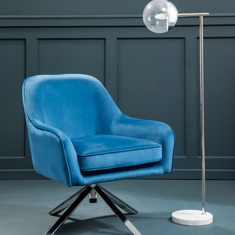 Vibrant blue midnight velvet swivel chair with sleek chrome star base perfect for stylish seating