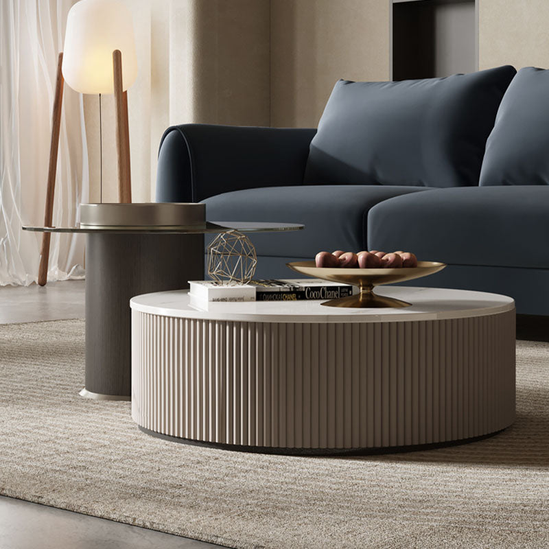 Beige cylindrical avery nesting coffee table with vertical ribbed texture and smooth white top with storage glass