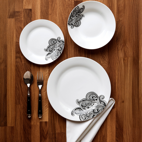 White ceramic dinner set plates with intricate black paisley design on edges from avie prince black dinner set