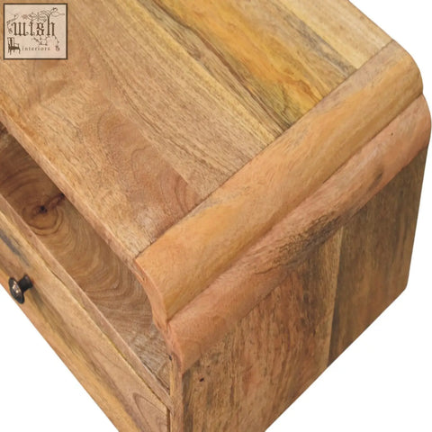 Avora wall mounted bedside table made of natural mango wood with a rustic light brown finish and visible grain patterns
