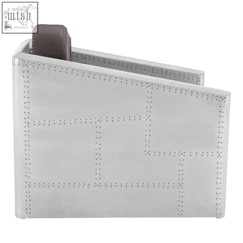 Silver airplane-inspired avro armchair with riveted panels and a dark brown faux leather cushion