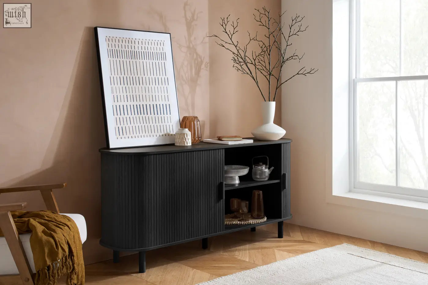 Axel 2 door fluted sideboard in black with curved design and glass doors from the fluted dining range displaying decor