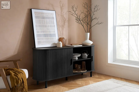 Axel 2 door fluted sideboard in black with curved design and glass doors from the fluted dining range displaying decor