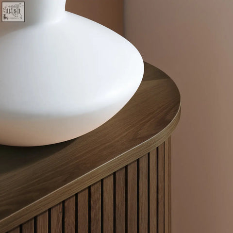 A sleek matte white ceramic lamp with a rounded bowl base perfect for styling the axel 2 door fluted dining sideboard