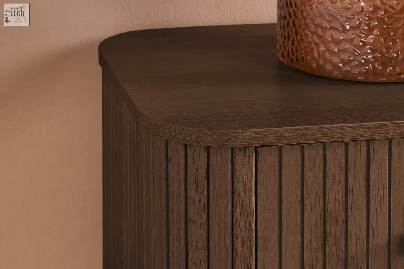 Dark brown wooden axel 6 drawer chest with vertical slats and curved top from the fluted bedroom range