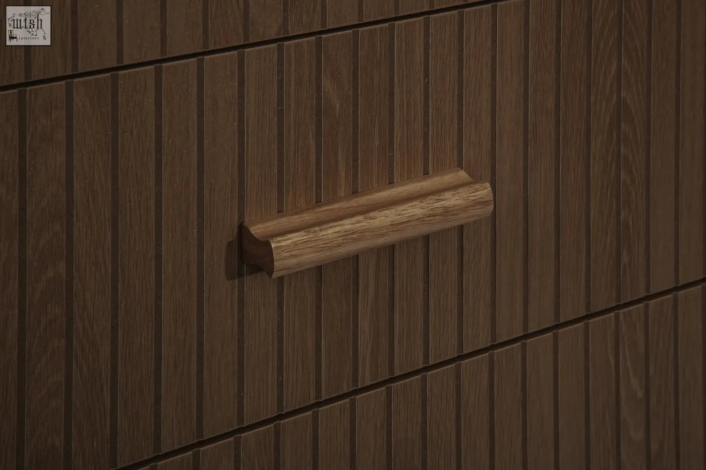 A sleek light brown wooden drawer handle with a smooth rounded design on the axel 6 drawer chest from the fluted bedroom range