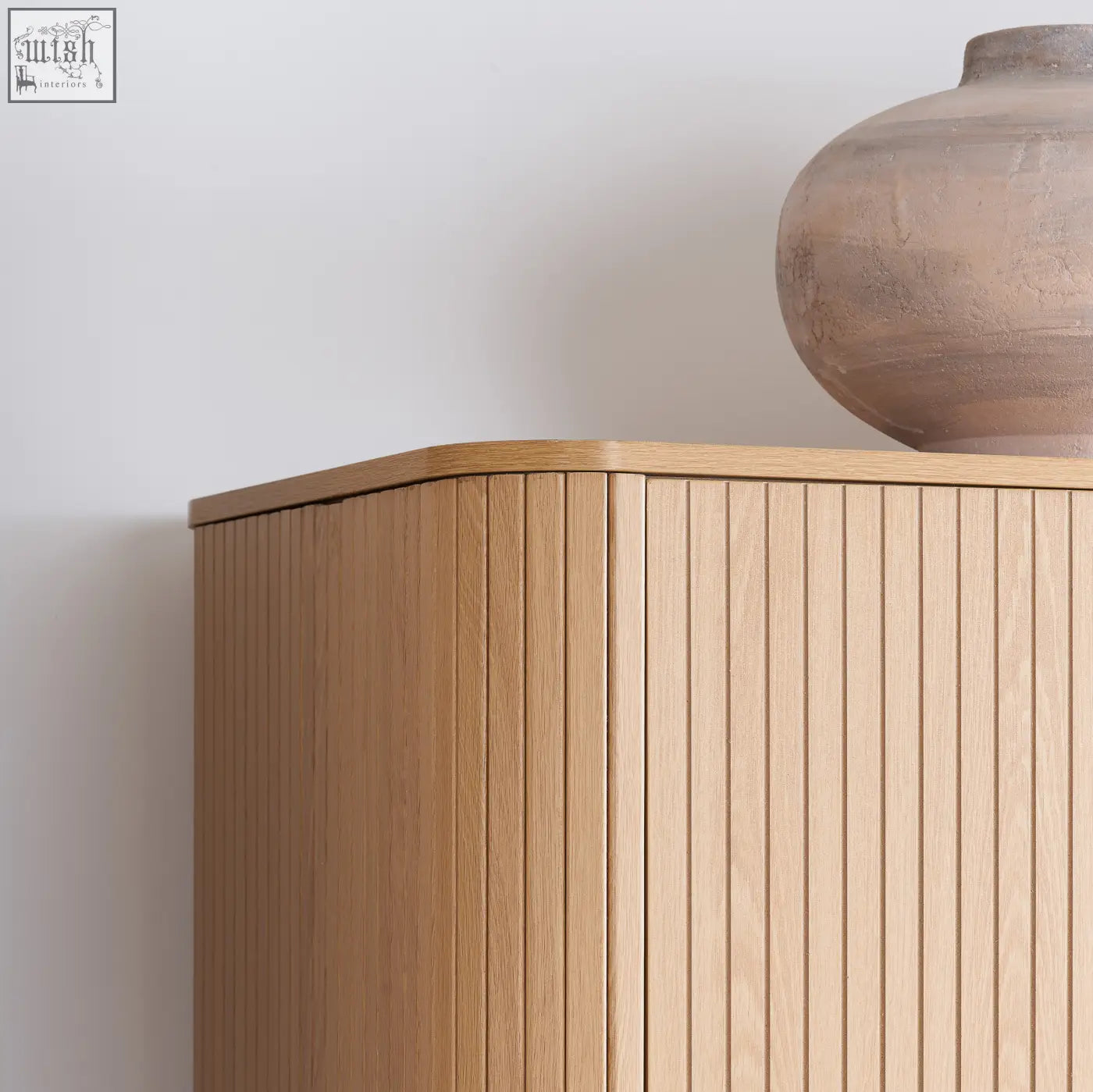 Axel wardrobe 2 door in light oak with vertical slats and rounded top edge from the exquisite fluted bedroom range