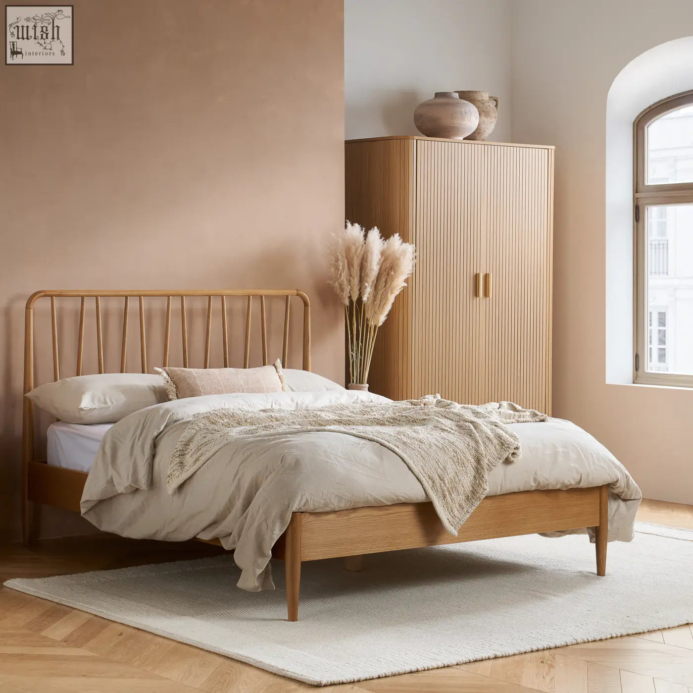 Light wood slatted bed frame with beige bedding and matching axel wardrobe 2 door from exquisite fluted bedroom range