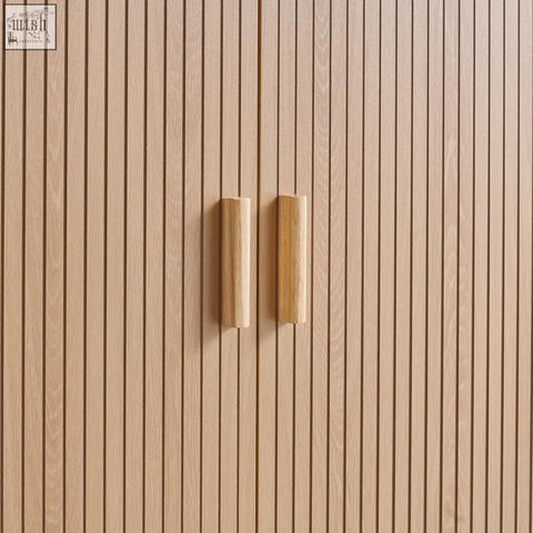 Axel wardrobe 2 door with light oak wooden cabinet doors and matching cylindrical handles from the exquisite fluted bedroom range