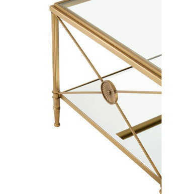 Axis coffee table with gold finish metal frame and mirrored glass top featuring decorative circular medallion lower shelf