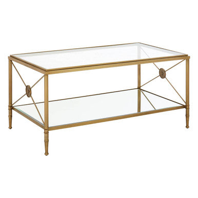 Axis coffee table with gold finish metal frame and clear glass top and bottom shelf features an x-shaped design