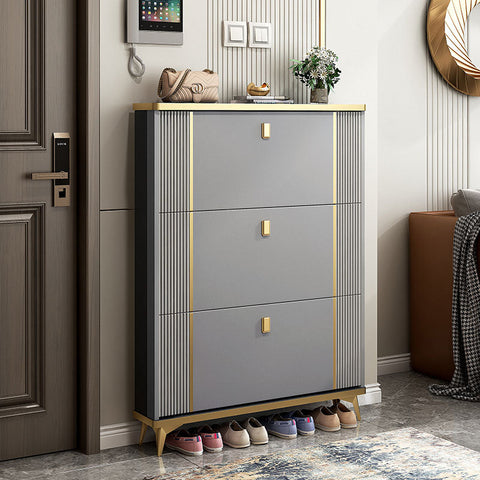 Modern gray ayling shoe storage cabinet with gold accents and vertical ridged panels for stylish shoe storage