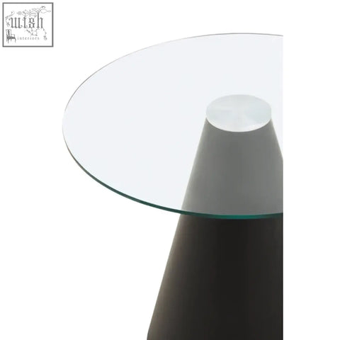 Azalea round clear glass dining table with a sleek minimalist design and tapered dark gray base