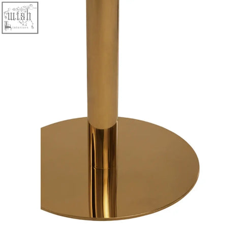 Gold-colored cylindrical table leg with polished metallic finish from azalea round marble dining table base