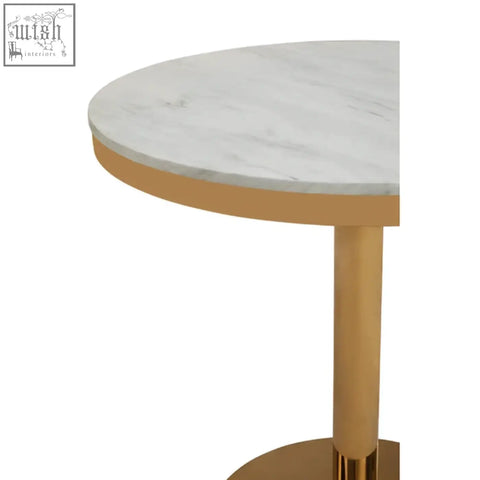 Azalea round marble dining table with a round white marble top and gold-finished pedestal base