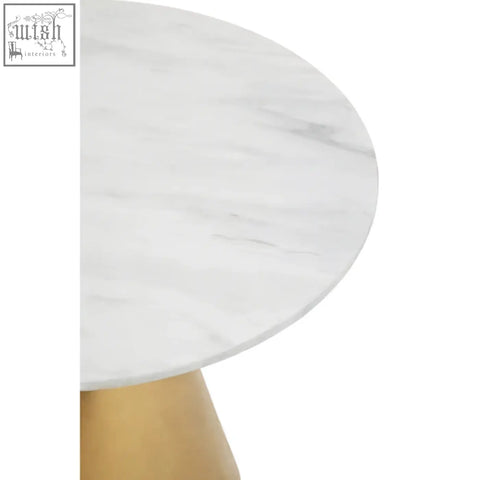 Azalea white marble top dining table with a sleek tapered gold base and smooth white marble tabletop surface