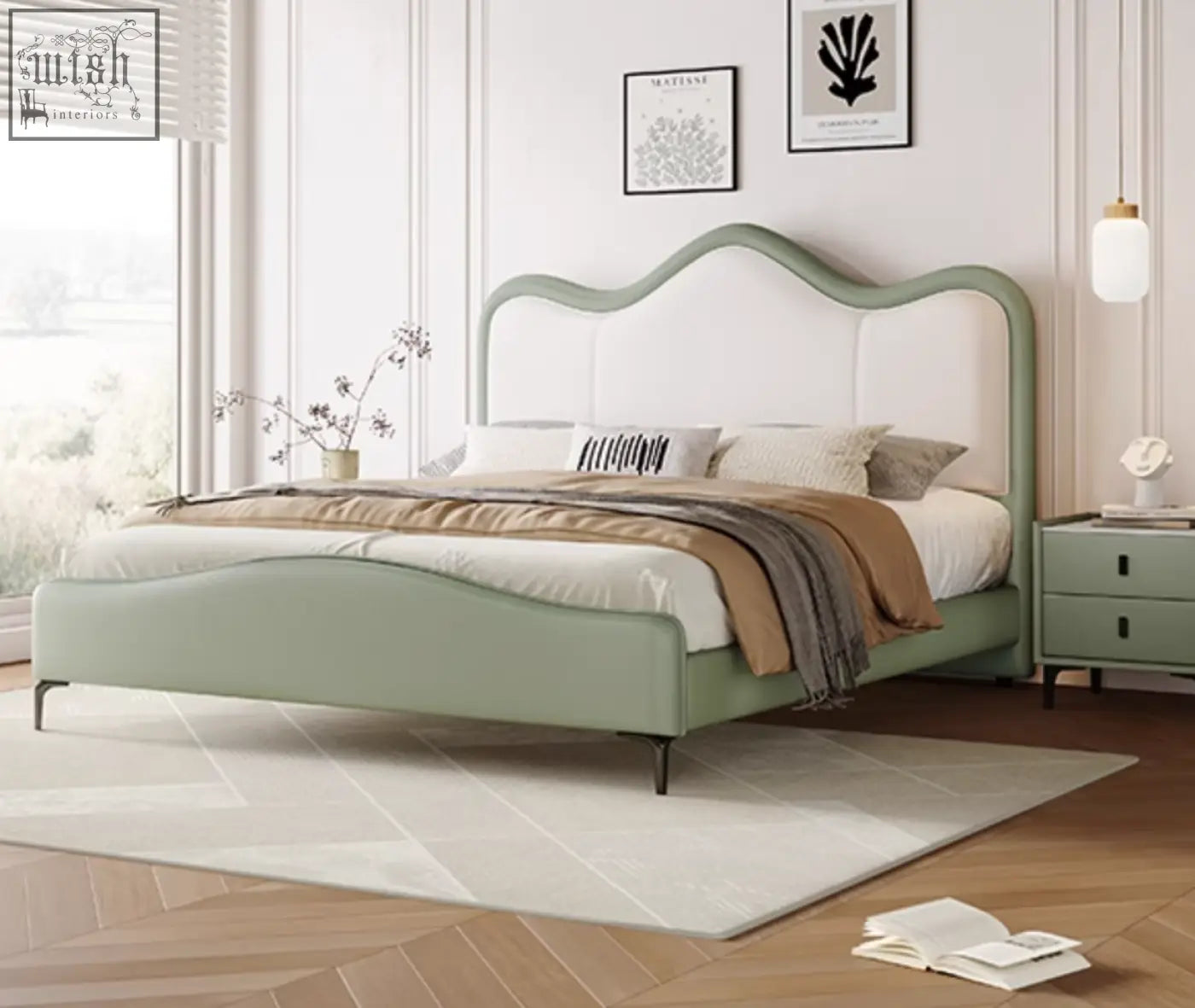 A sage green badham king size bed with leather upholstery and white tufted curved headboard and footboard